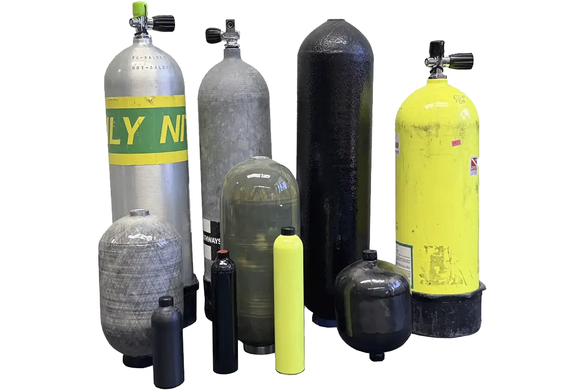 Assorted composite and metal pressure vessels, including SCBA, SCUBA, CNG, and industrial gas cylinders, ready for inspection and recertification.