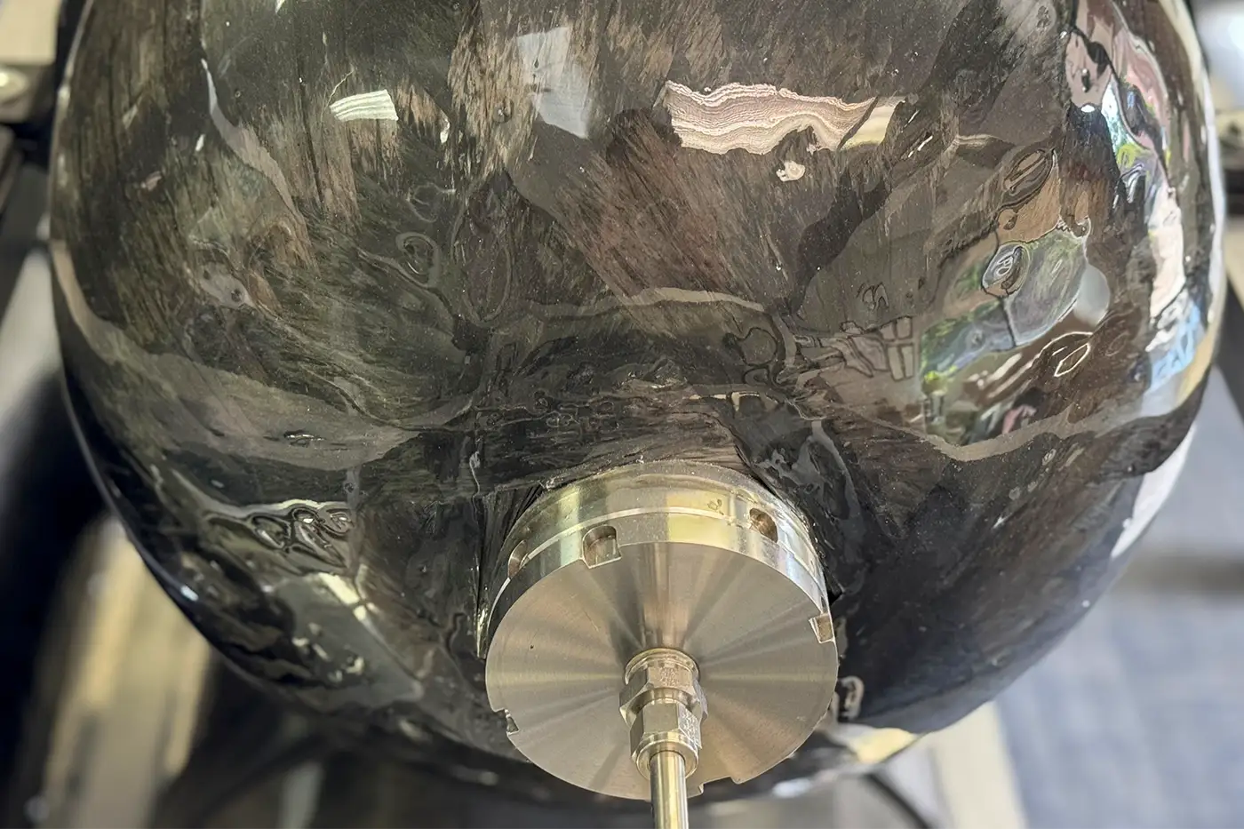 Close-up view of a 17 inch 5000 psi (350 bar) Type III Family Pressure Vessel showing large port fitting for high-pressure gas transfer and ground storage applications.