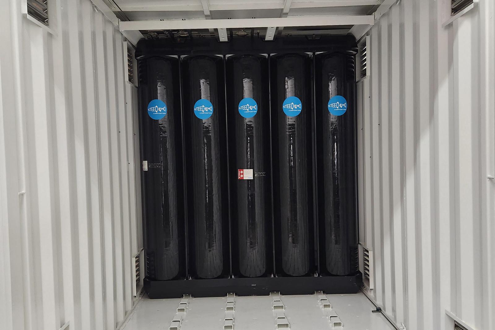 Partially filled hydrogen storage container showing modular layout for gas vessels and equipment space optimization.