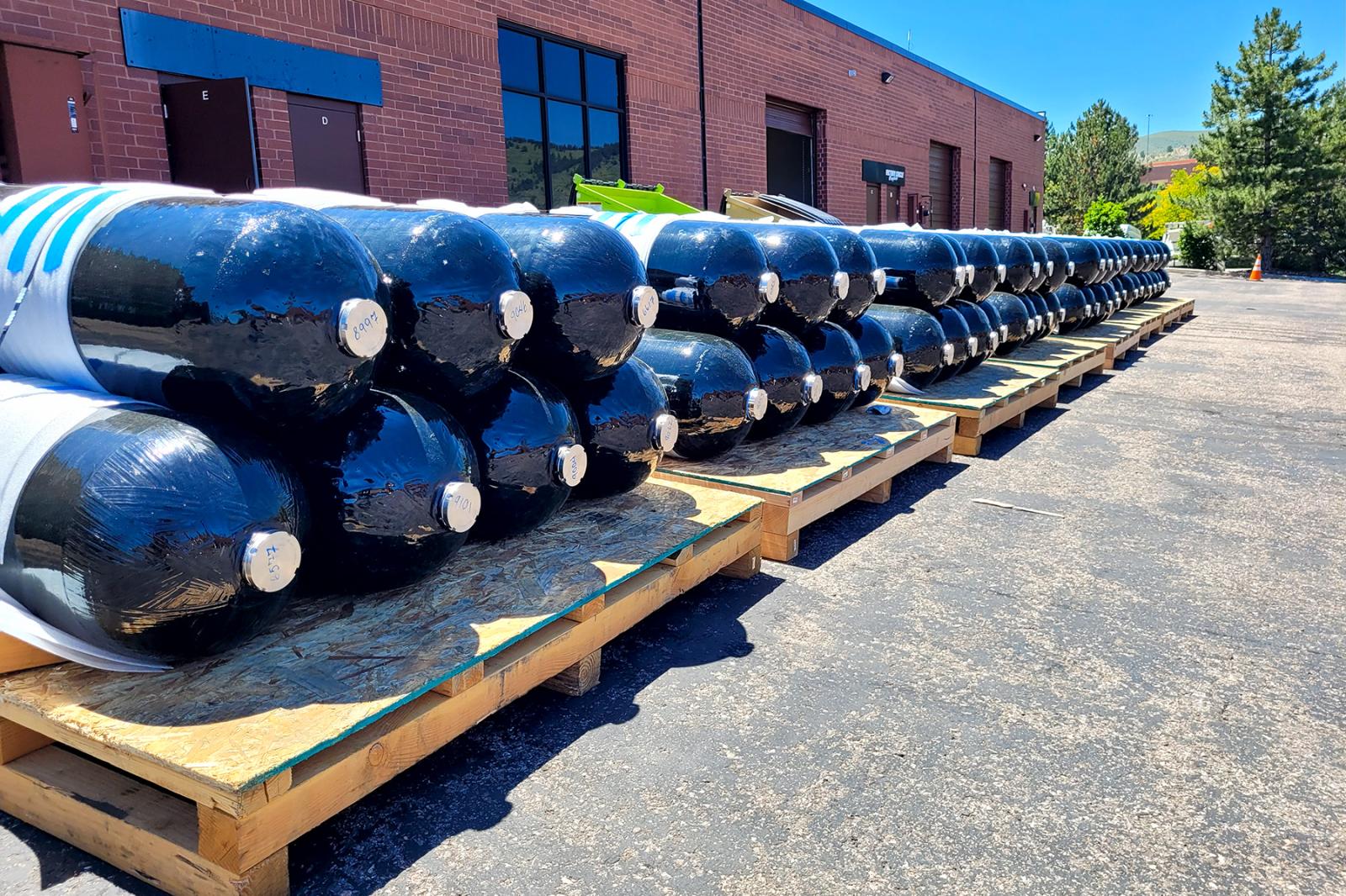 The 270L Type 3 Composite Overwrapped Pressure Vessels (COPVs), DOT-certified and rated for 350 bar (5000 psi), are prepared for shipment to a utility-scale bulk hydrogen storage system. These high-performance gas transport vessels are engineered for durability, efficiency, and reliability in large-scale hydrogen storage and distribution applications.