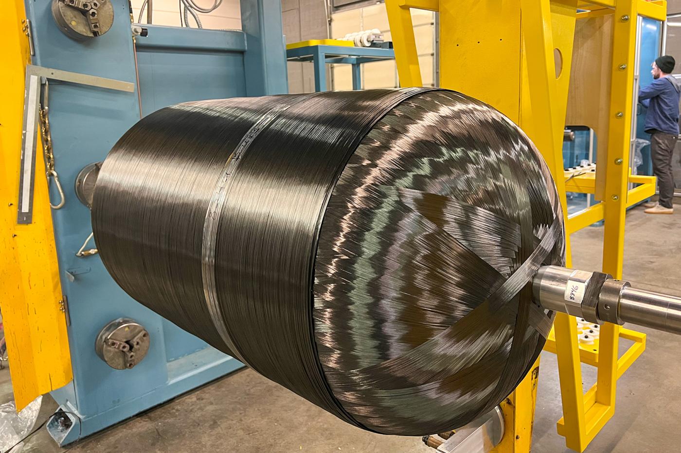 Freshly filament-wound composite pressure vessel (COPV) using high-strength carbon fiber on a 4-axis machine—soon to be finished for hydrogen, CNG, nitrogen, helium, or argon storage.