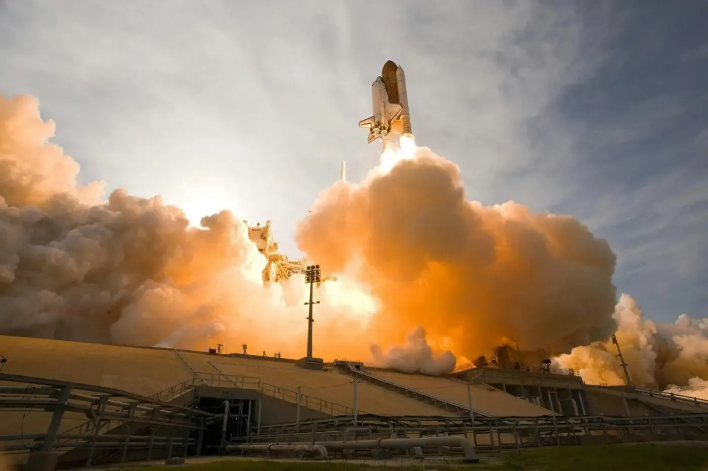 Space shuttle launch captured at liftoff—demonstrating the extreme performance demands of aerospace applications powered by high-pressure composite pressure vessels for fuel and gas storage.
