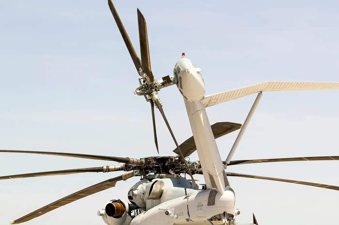 Unmanned aerial vehicle (UAV) used in the defense industry, shown alongside a large composite pressure vessel engineered for high-pressure hydrogen or CNG storage. Ideal for mobile fuel support and forward-deployed energy systems.