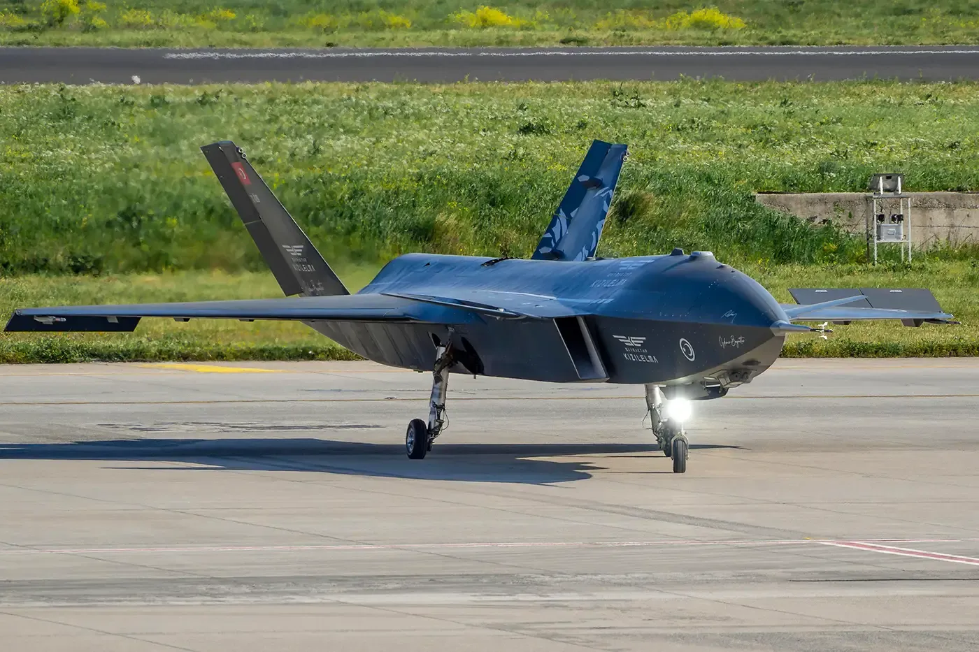 Stealth-style unmanned military aircraft on runway, highlighting defense and aerospace applications of small-format high-pressure gas vessels.