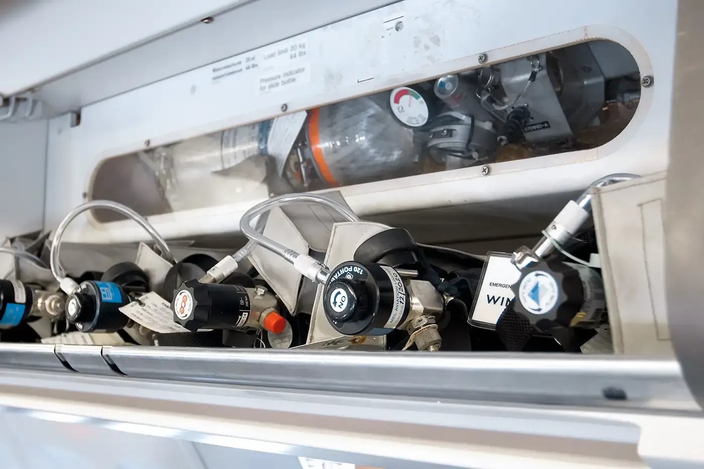 Closeup of emergency breathing system with cylinders, valves, and tubing, highlighting SCBA recertification for safety and compliance in critical applications.