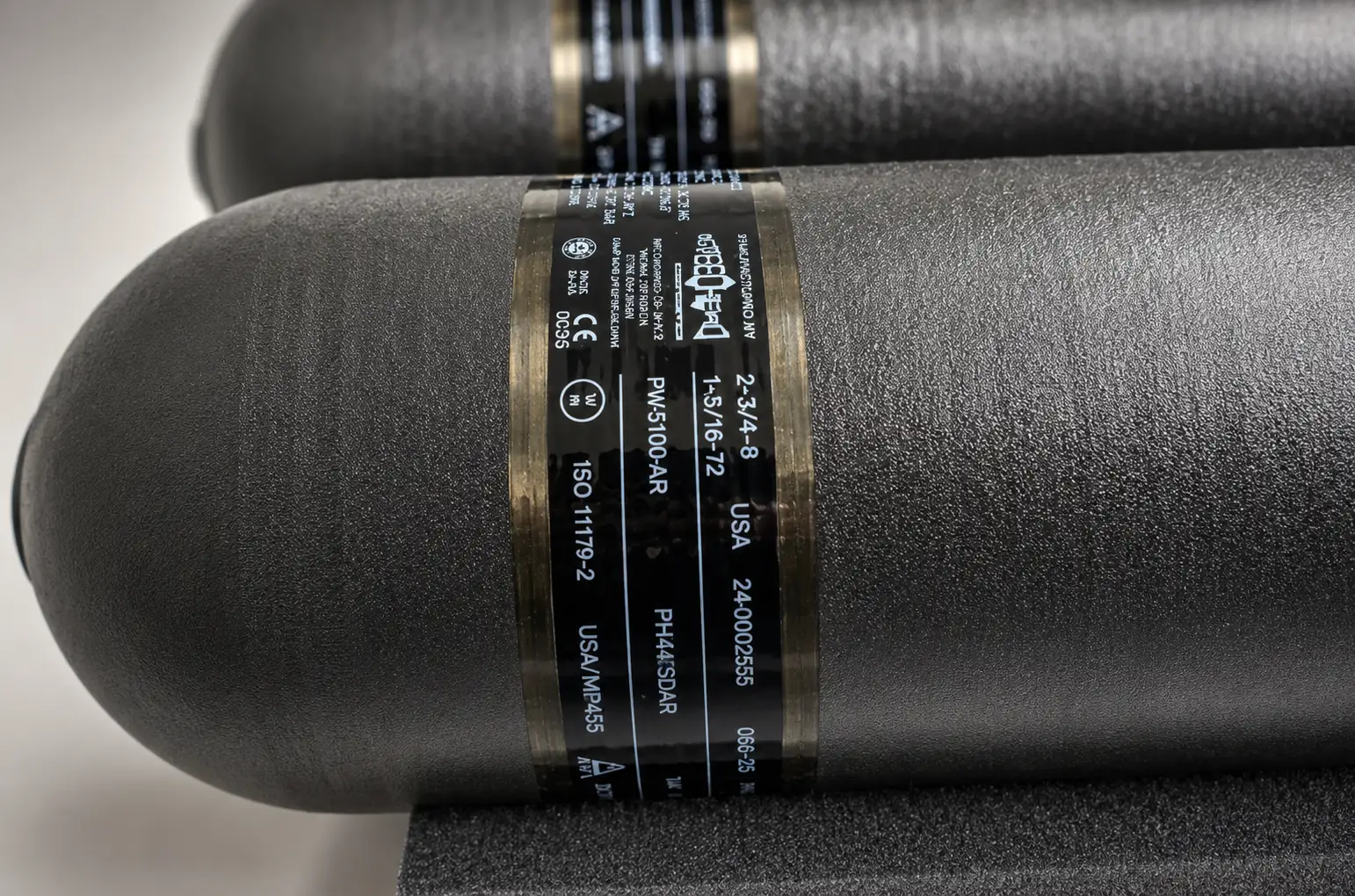 Steelhead composite pressure vessel in production with certification markings.